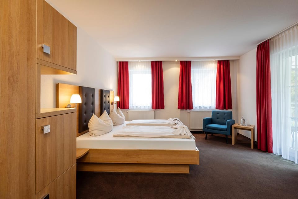 Bed, Seating area, towels, wardrobe