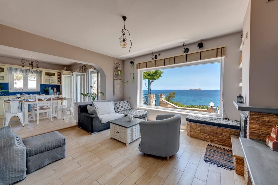 Natural landscape, View (from property/room), Living room, Seating area, Sea view