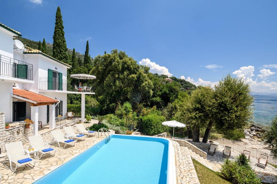 Property building, Natural landscape, Pool view, Swimming pool, sunbed