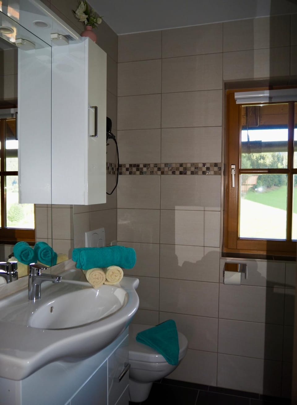 Shower, Bathroom, hair dryier, towels, washing machine