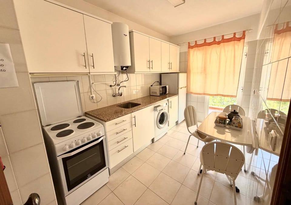 Kitchen or kitchenette, Dining area, oven, stove, toaster, washing machine