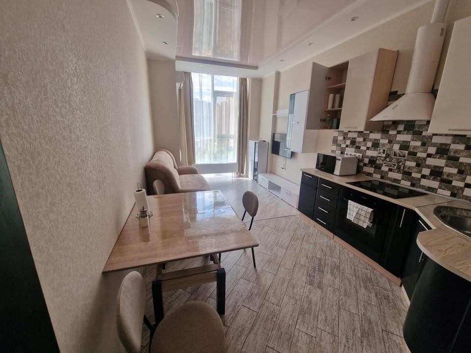 Kitchen or kitchenette, Living room, Seating area, Dining area, stove