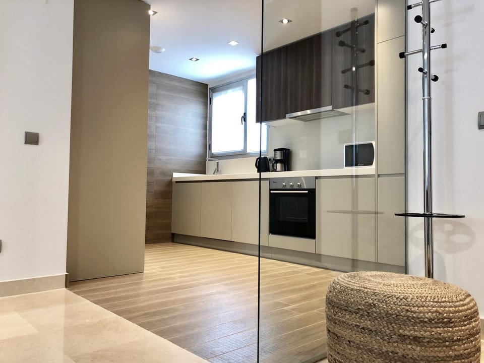 Kitchen or kitchenette, dishwasher, oven, stove