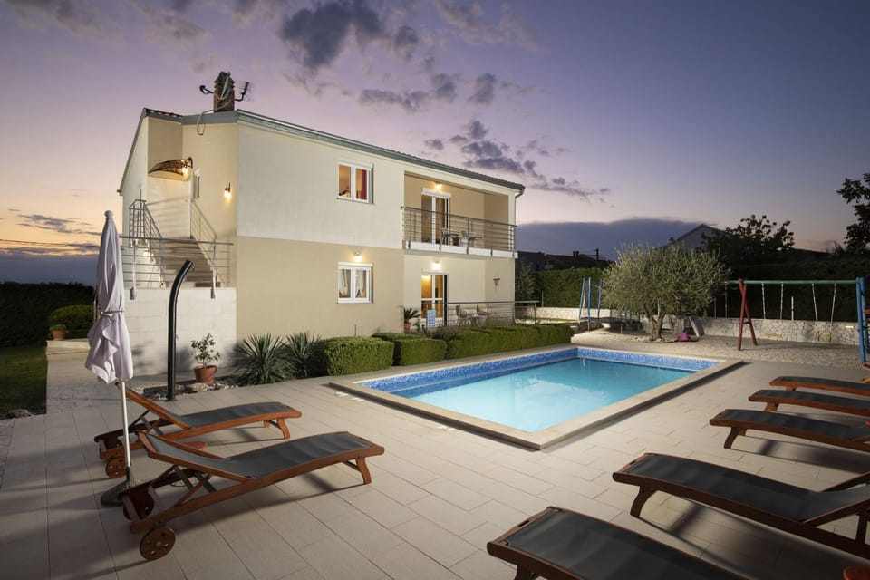 Property building, Patio, Swimming pool, sunbed
