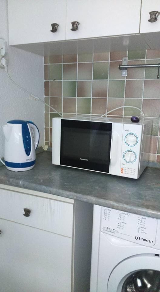 Kitchen or kitchenette, microwave