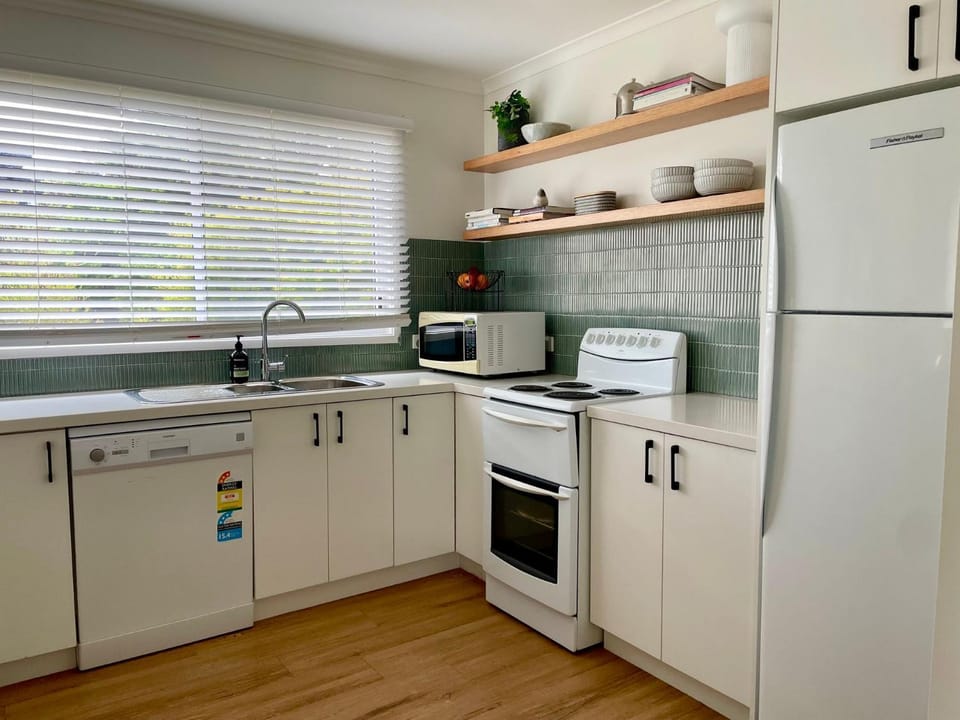 Kitchen or kitchenette, dishwasher, oven, stove