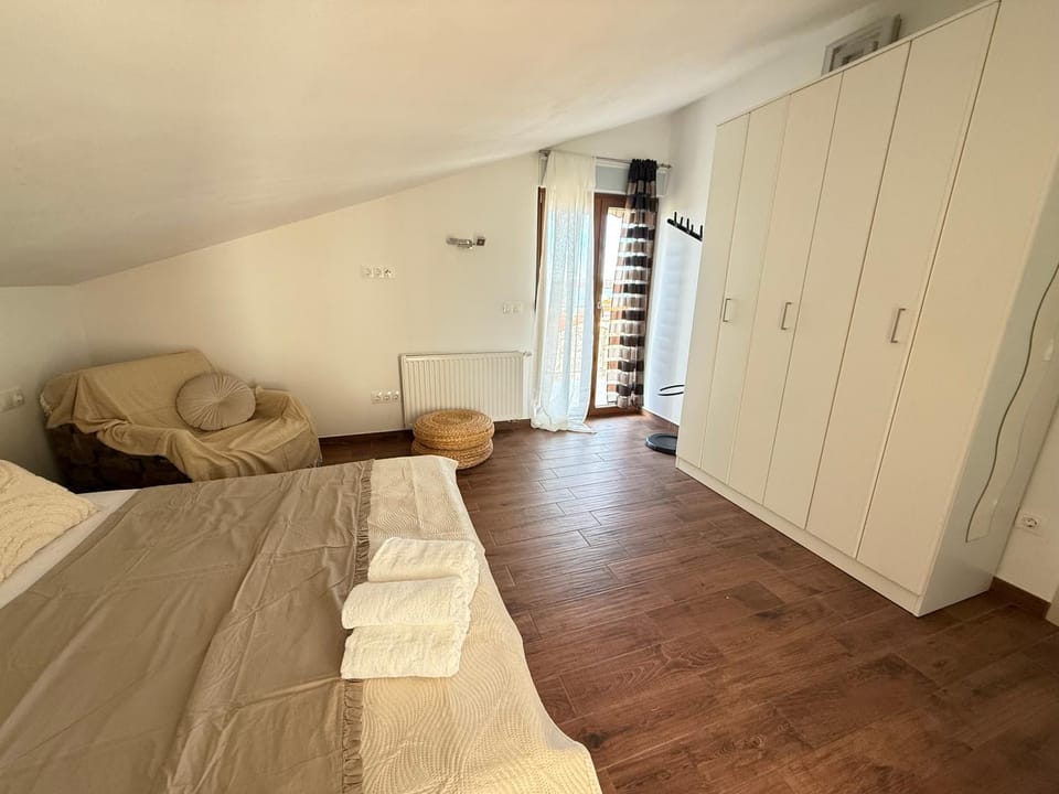 Bed, Seating area, Bedroom, towels, wardrobe