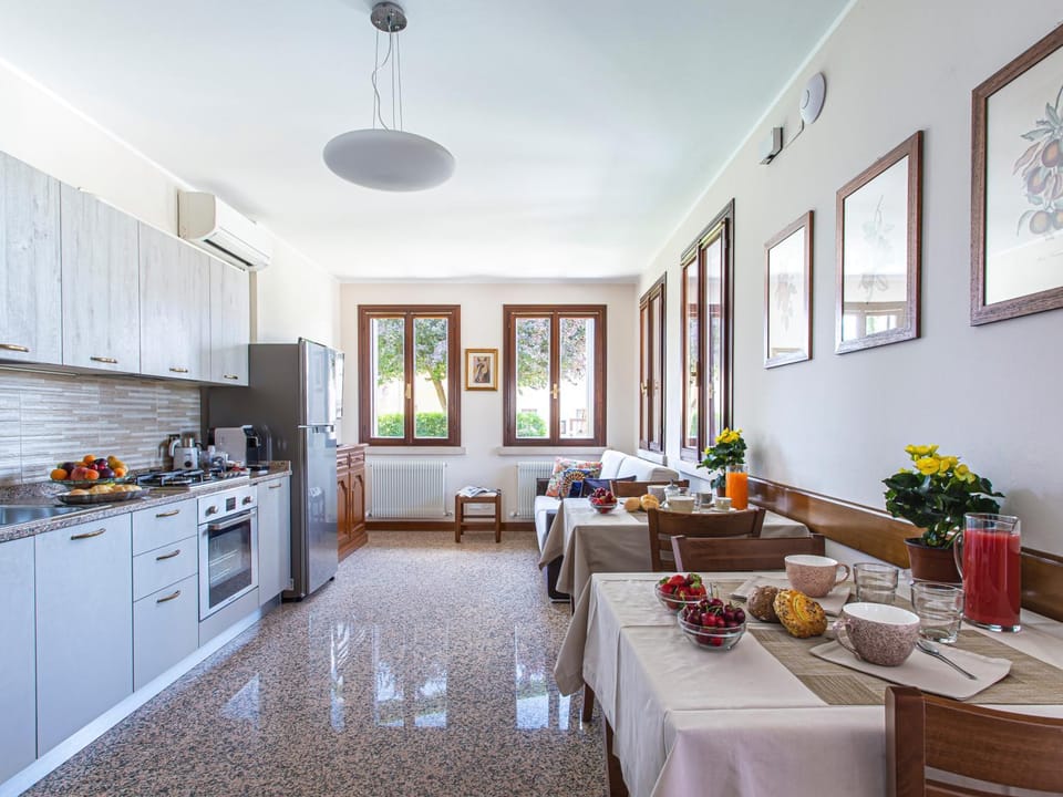 Kitchen or kitchenette, Living room, Seating area, Dining area, dishwasher, oven, stove, kitchen, air conditioner