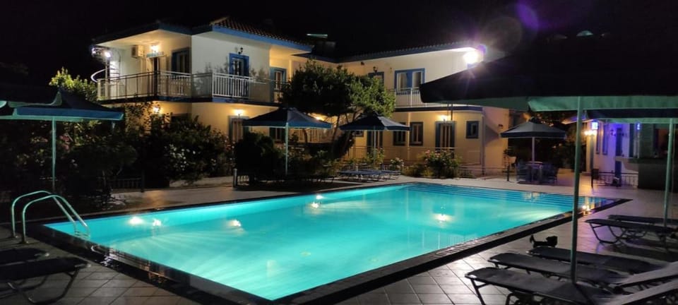 Property building, Patio, Night, Pool view, Swimming pool, sunbed