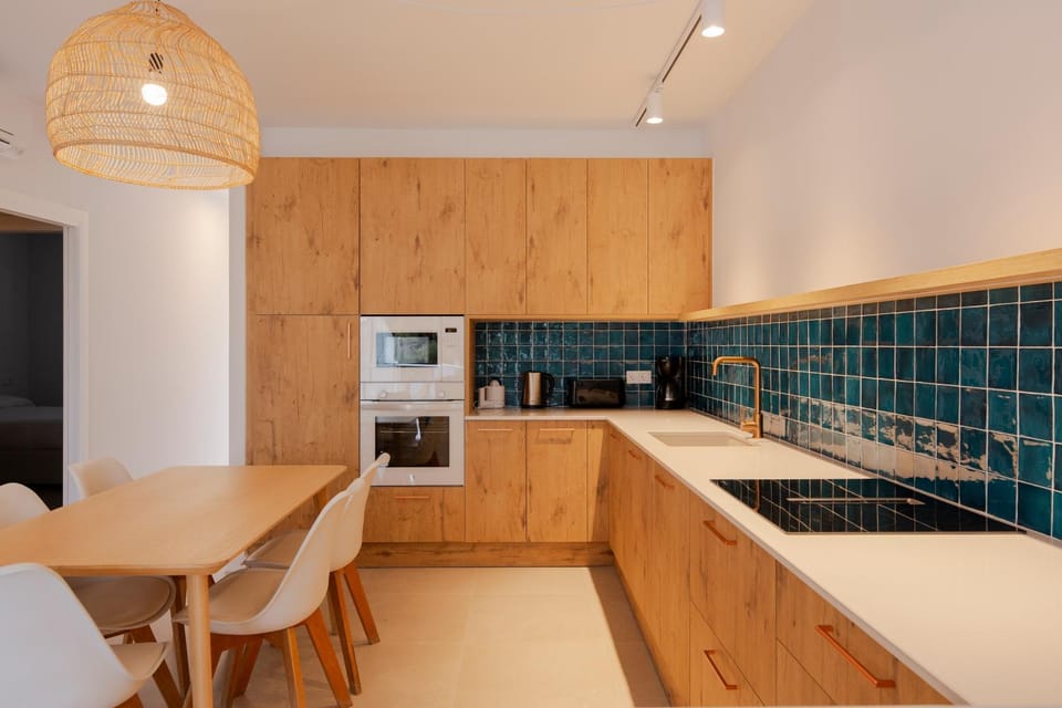 Kitchen or kitchenette, dishwasher, oven, stove, toaster