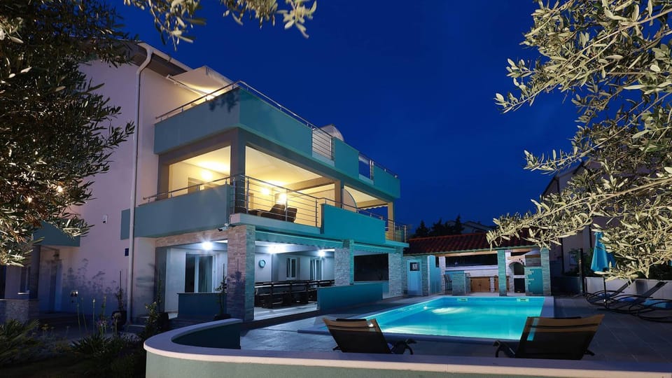 Property building, Patio, Night, Pool view, Swimming pool, sunbed