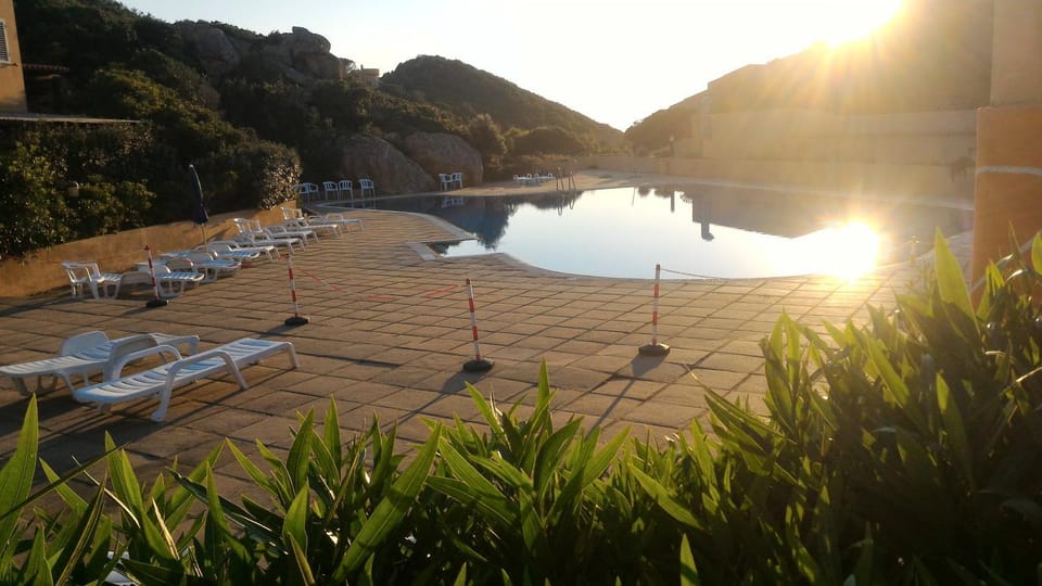 Property building, Natural landscape, Pool view, Swimming pool, sunbed