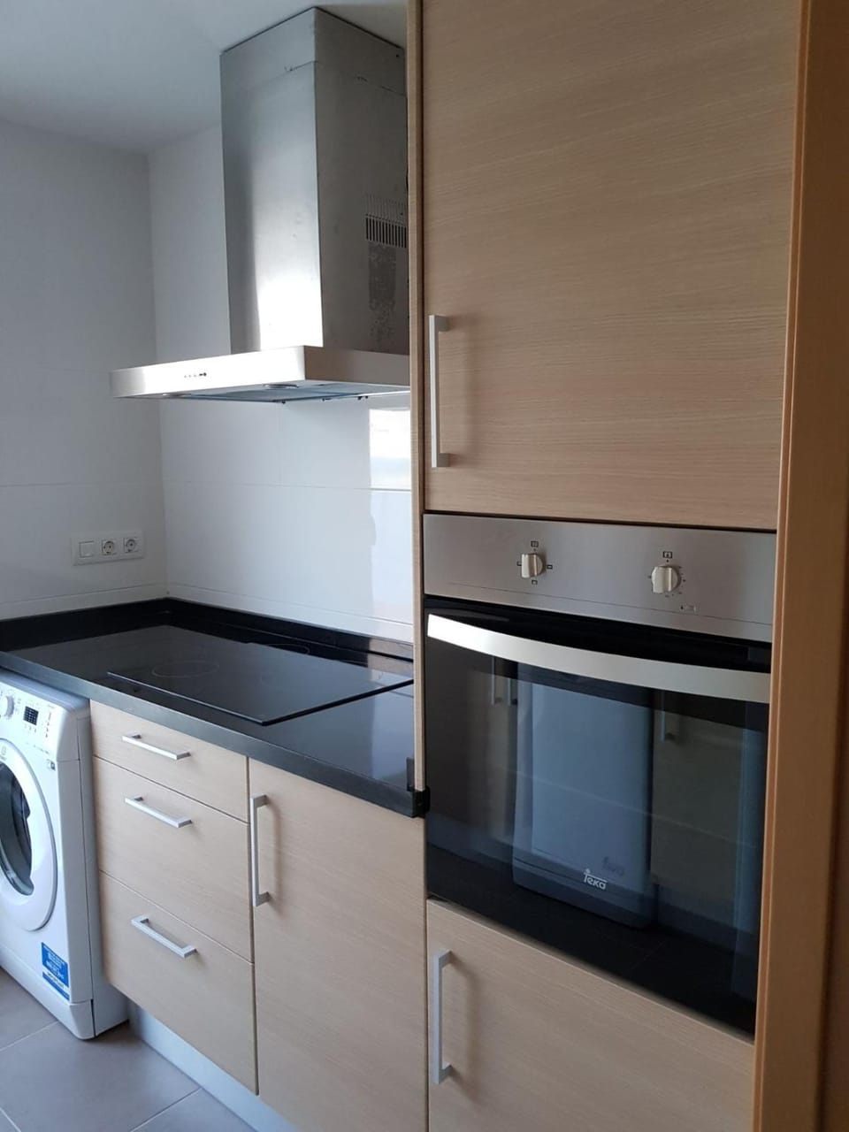 Kitchen or kitchenette, stove, washing machine
