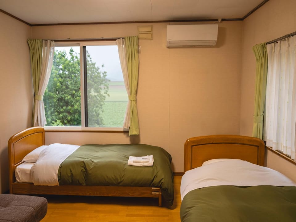 Bed, Photo of the whole room, Bedroom, towels, air conditioner