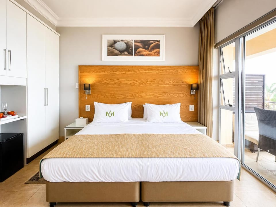 Patio, Bed, Coffee/tea facilities, Seating area, Bedroom, Garden view, Sea view, minibar, wardrobe