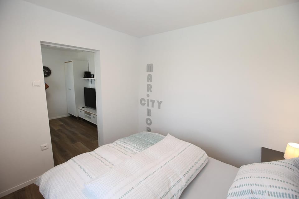 Bed, Property logo or sign, Decorative detail, Bedroom