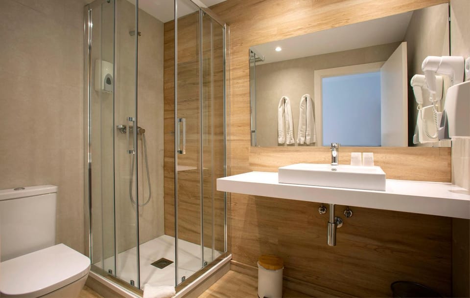 Shower, Toilet, Bathroom, hair dryier, towels