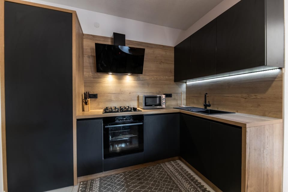Kitchen or kitchenette, dishwasher, oven, stove, toaster