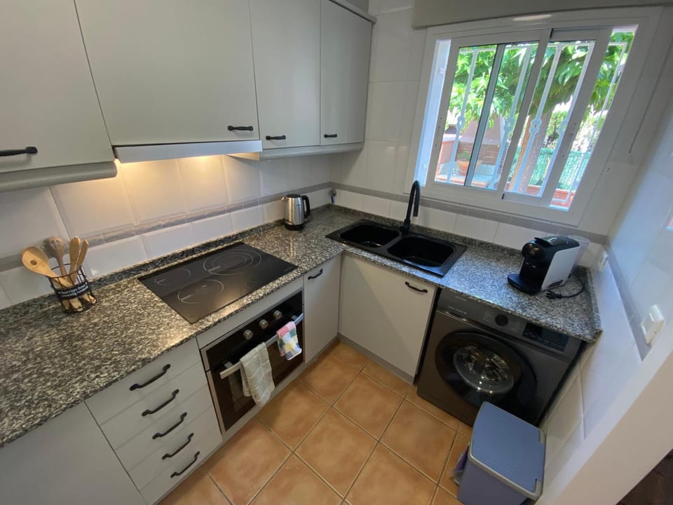 Kitchen or kitchenette, dishwasher, oven, stove, toaster
