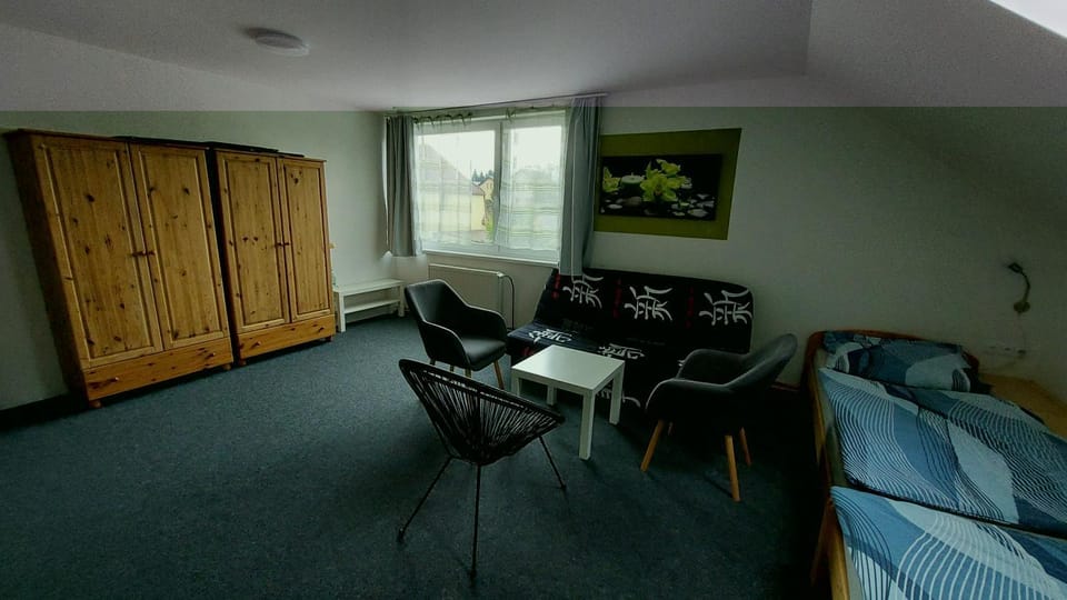 Bed, Seating area, wardrobe