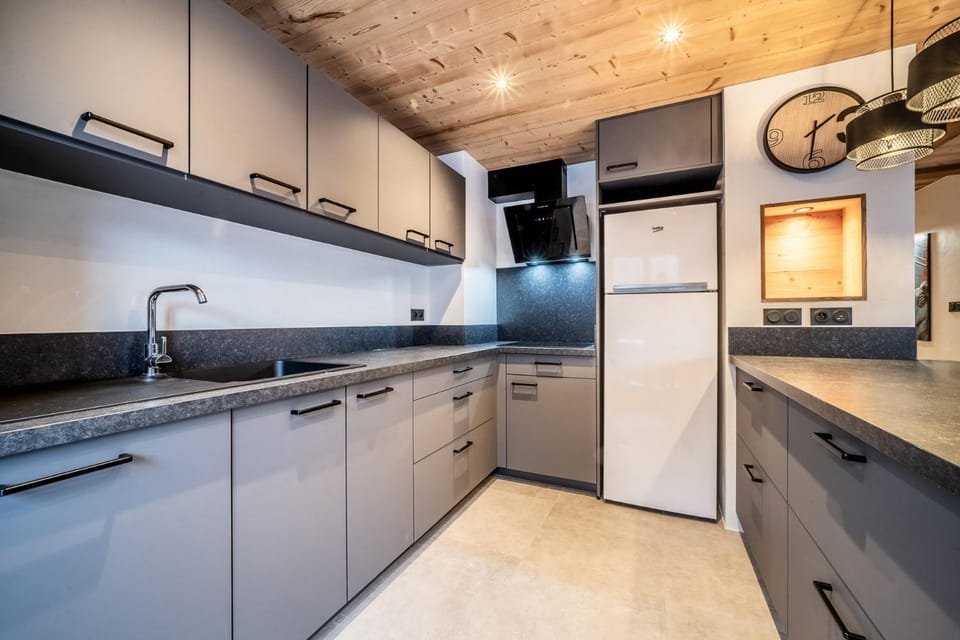 Kitchen or kitchenette, dishwasher, oven, stove