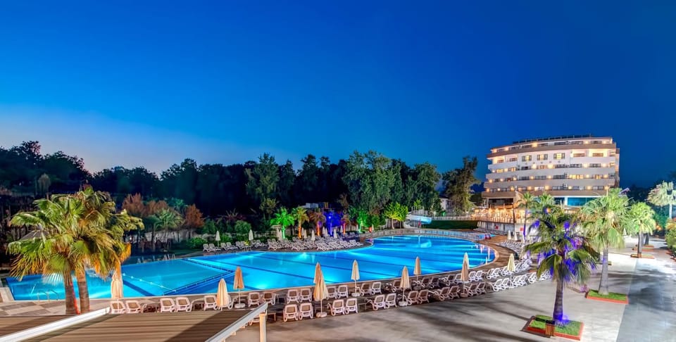 Property building, Night, Natural landscape, Activities, Garden, View (from property/room), Seating area, Garden view, Pool view, Sea view, Swimming pool, Entertainment, Non alcoholic drinks, sunbed