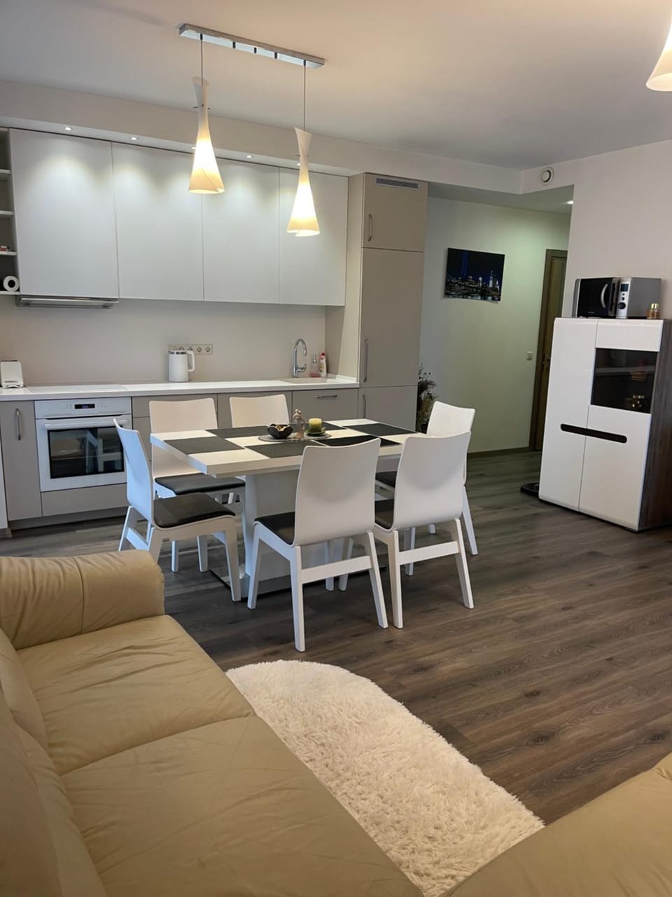 Kitchen or kitchenette, Living room, Seating area, Dining area, dishwasher, oven, stove, toaster