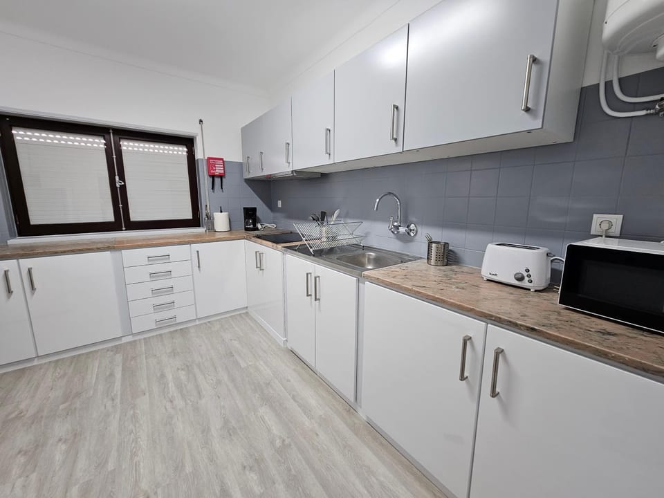 Kitchen or kitchenette, stove, toaster