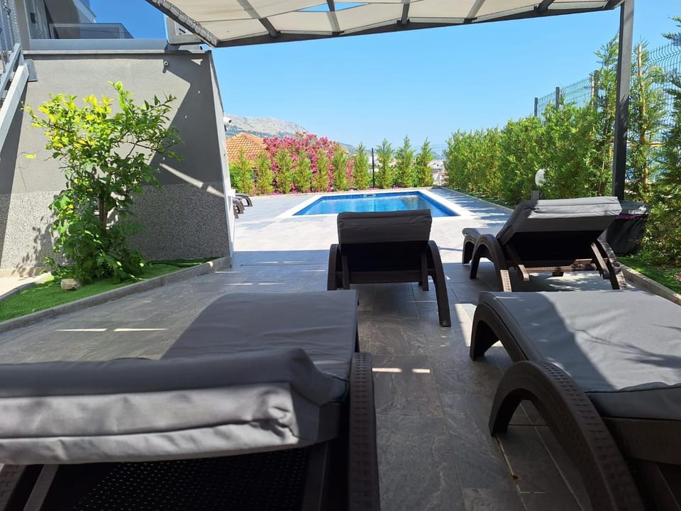Patio, Seating area, Swimming pool, sunbed