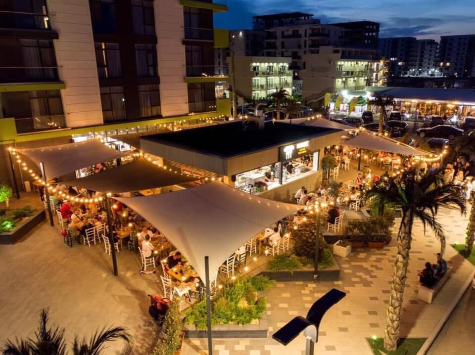 Nearby landmark, Restaurant/places to eat, Night, Neighbourhood, City view