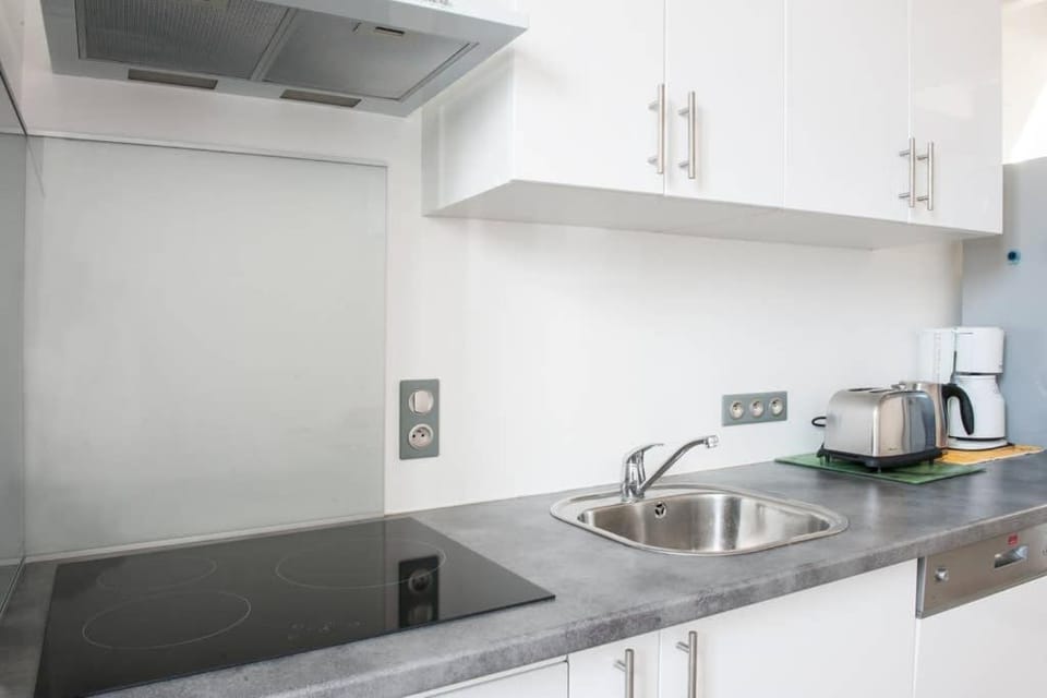 Kitchen or kitchenette, stove, toaster