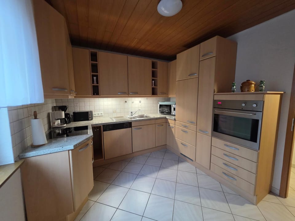 Kitchen or kitchenette, dishwasher, stove, toaster