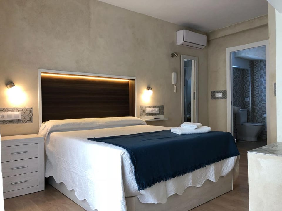 Bed, Photo of the whole room, Bedroom, towels, air conditioner