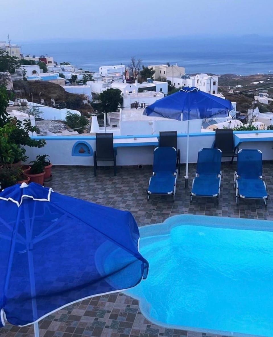 Property building, Patio, Day, Natural landscape, View (from property/room), Pool view, Sea view, Swimming pool, sunbed