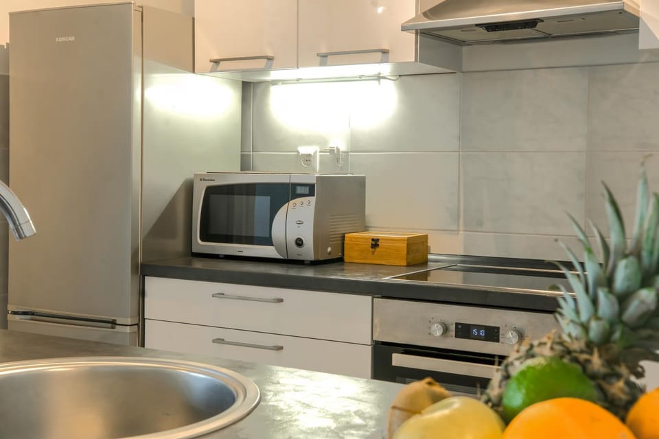 Kitchen or kitchenette, dishwasher, oven, stove, toaster