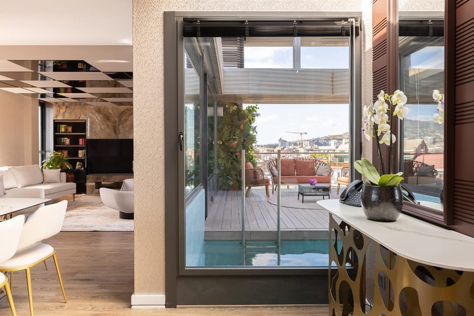 Balcony/Terrace, Living room, Seating area, Dining area, Pool view