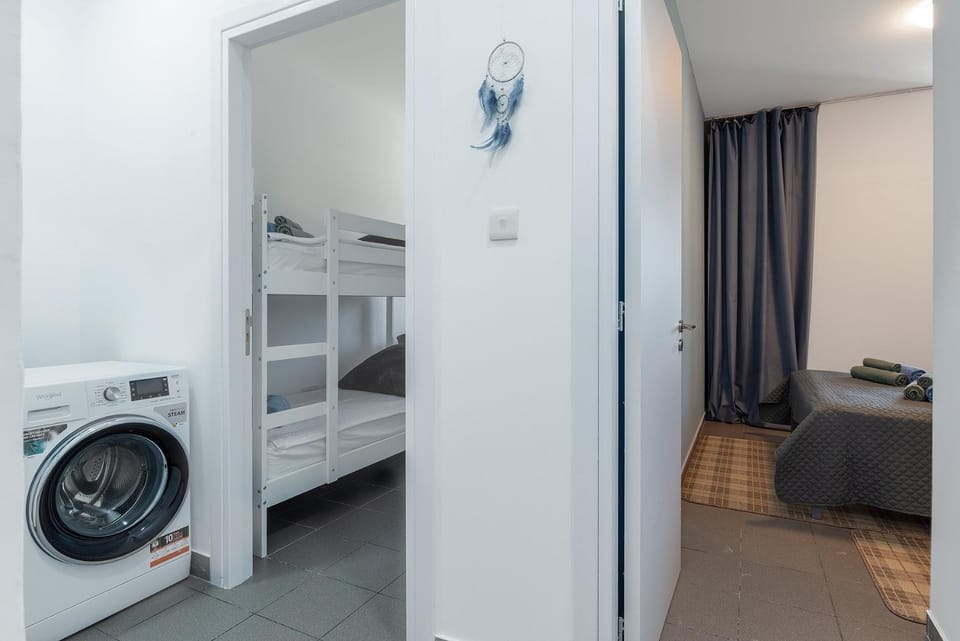Bed, Bedroom, bunk bed, towels, washing machine