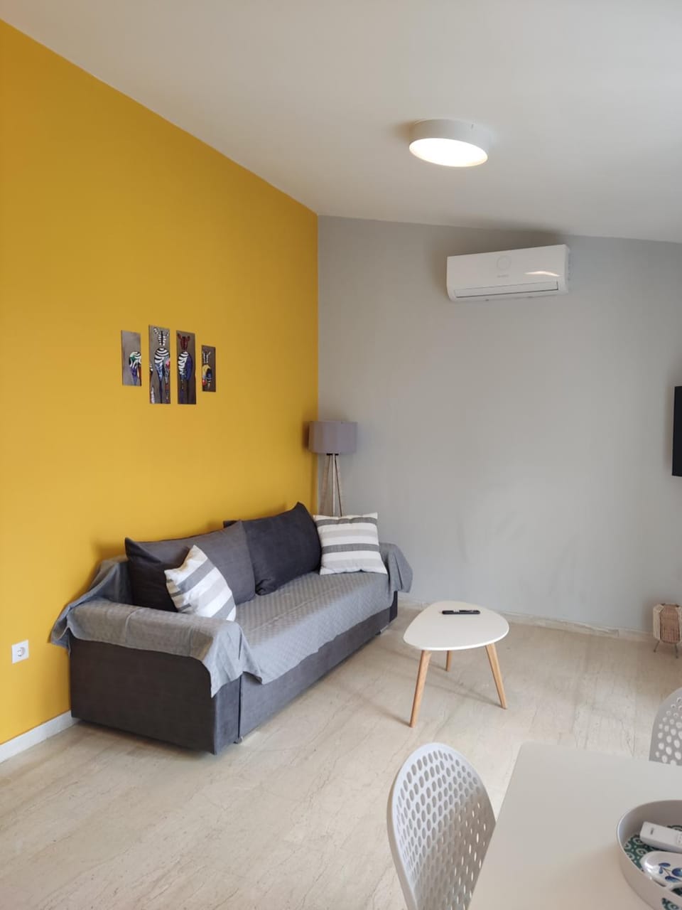 Bed, TV and multimedia, Living room, Seating area, air conditioner