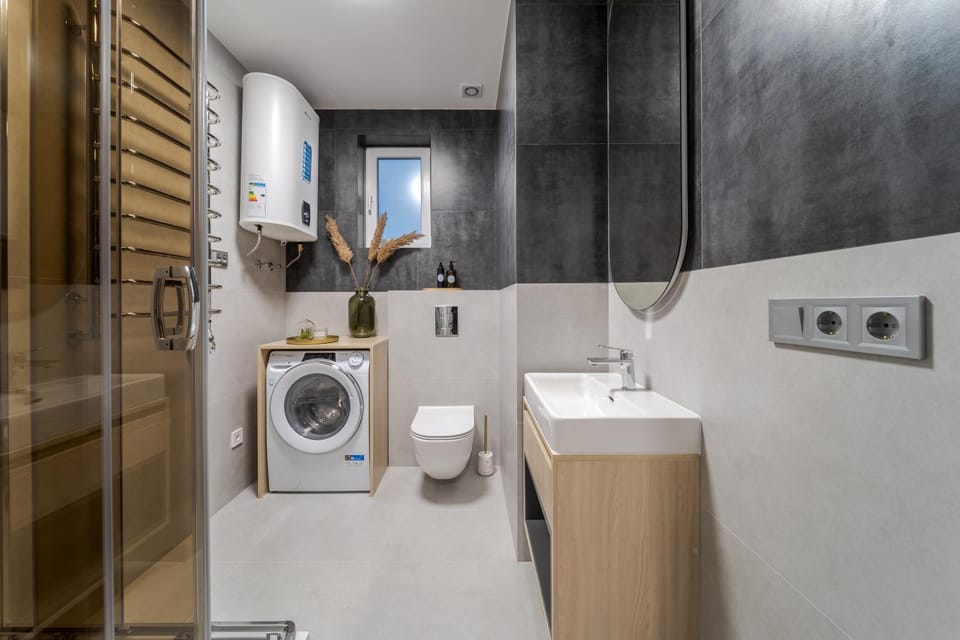 Toilet, towels, washing machine, dryer