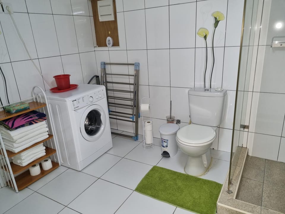 Shower, Toilet, Bathroom, towels, washing machine, dryer