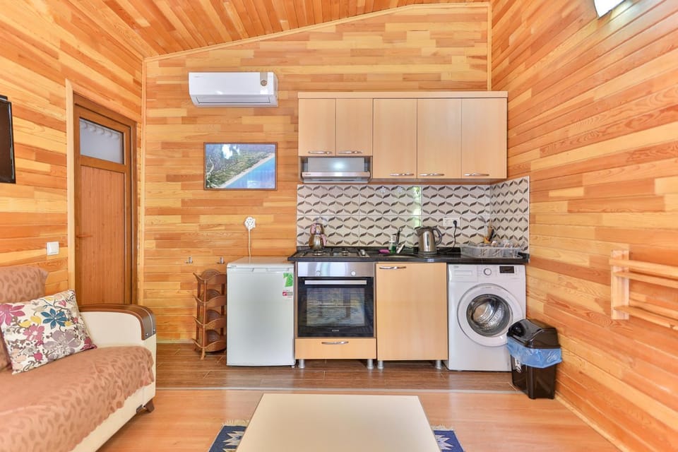 Kitchen or kitchenette, Seating area, stove, washing machine, air conditioner