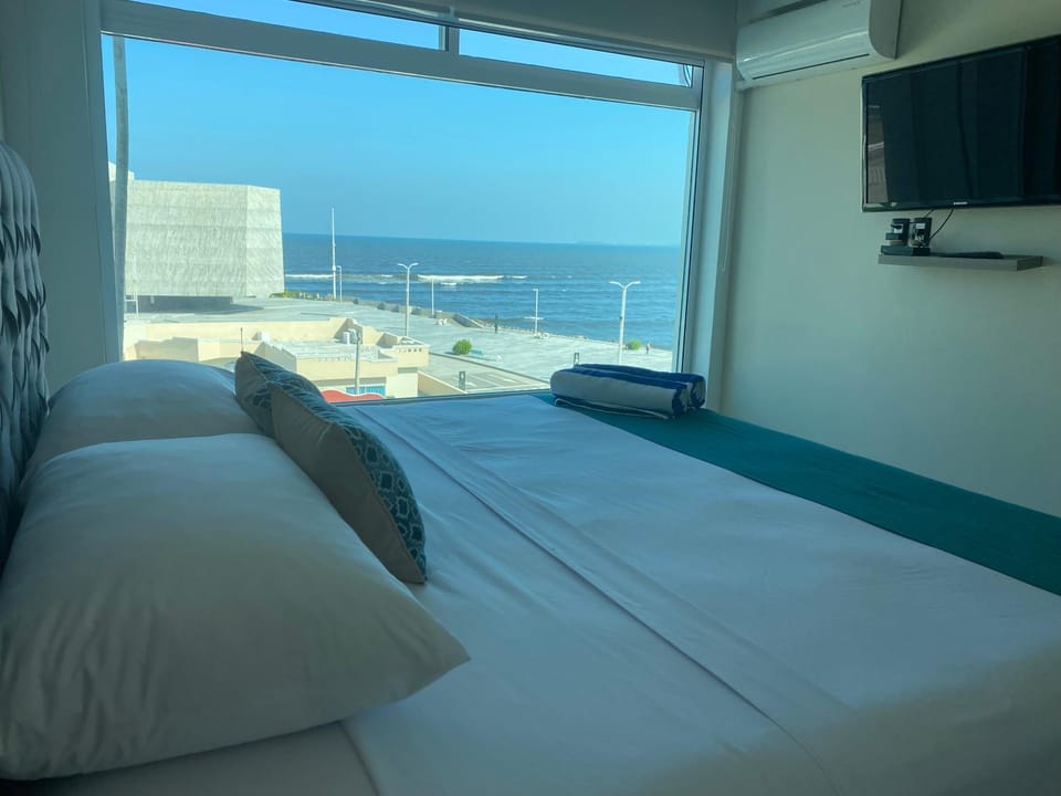 Bed, Natural landscape, TV and multimedia, Bedroom, Sea view