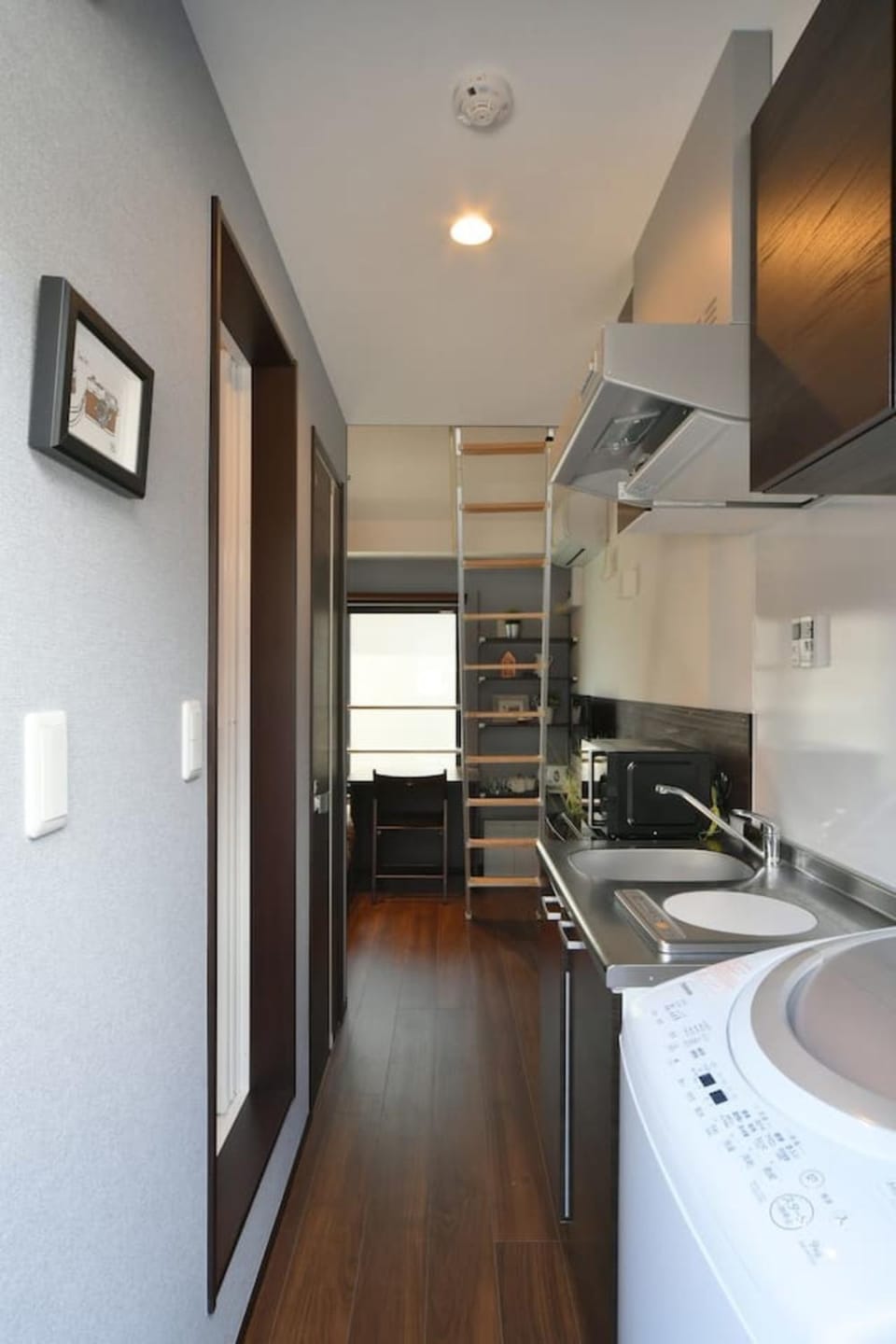 Kitchen or kitchenette, washing machine