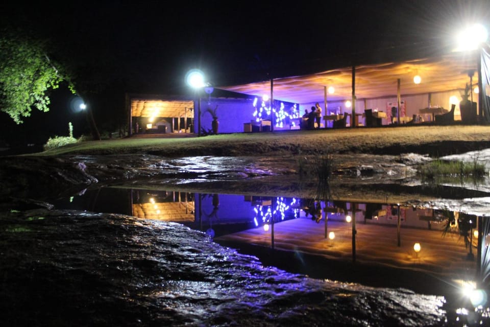 Property building, Restaurant/places to eat, Night, People, Natural landscape, Lounge or bar, Dining area, Evening entertainment, River view, Dinner, group of guests, Family