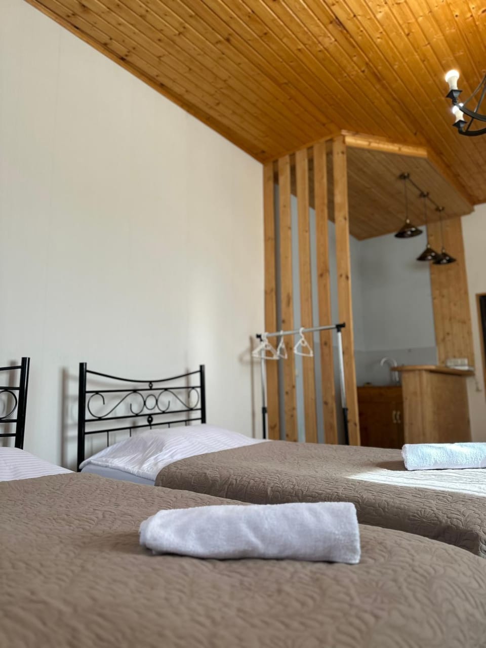 Bed, towels, wardrobe