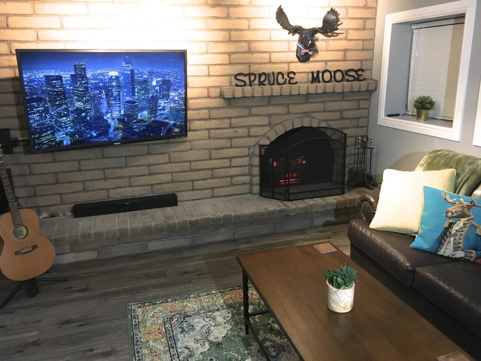 Property logo or sign, Property logo or sign, TV and multimedia, Living room, Seating area
