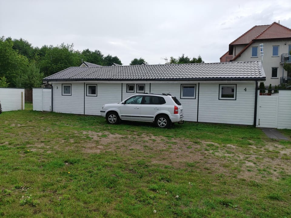 Radosna Zatoka - DOMKI Z OGRODZENIEM Campground/ 
RV Resort in West Pomeranian Voivodeship, Poland