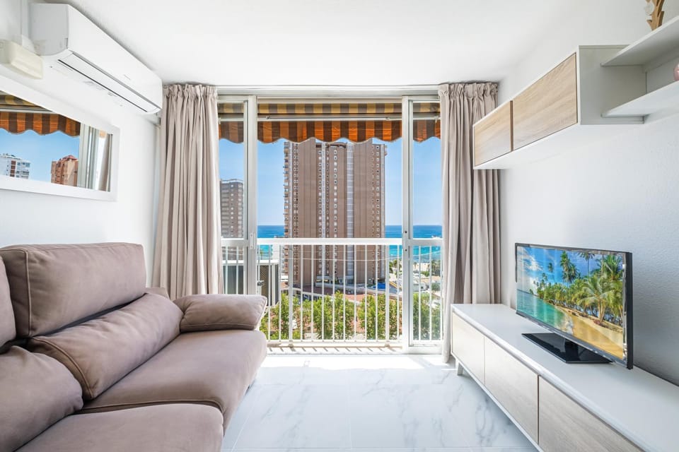 Bed, Natural landscape, TV and multimedia, View (from property/room), Living room, Sea view, air conditioner