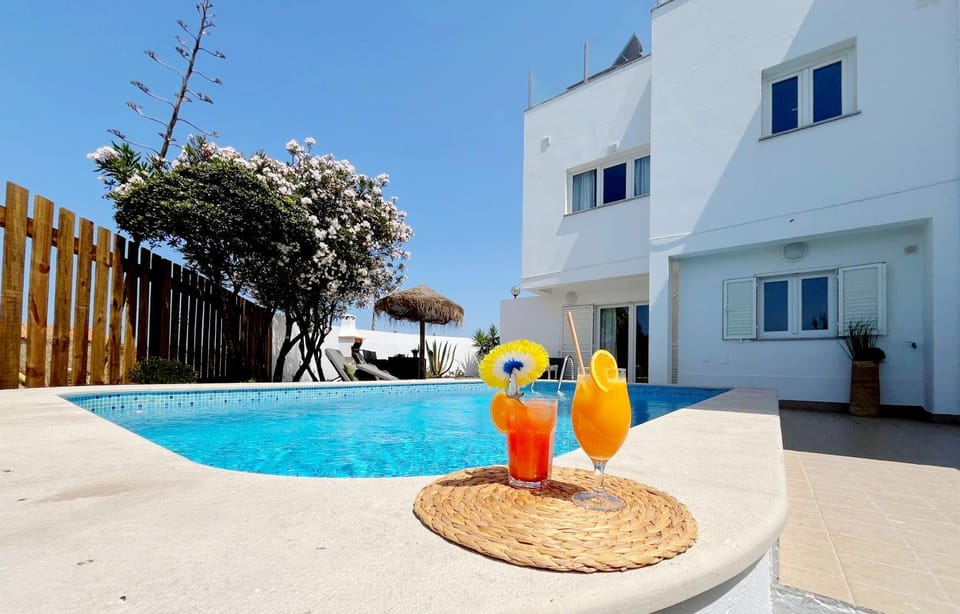 Property building, Patio, Pool view, Swimming pool, sunbed
