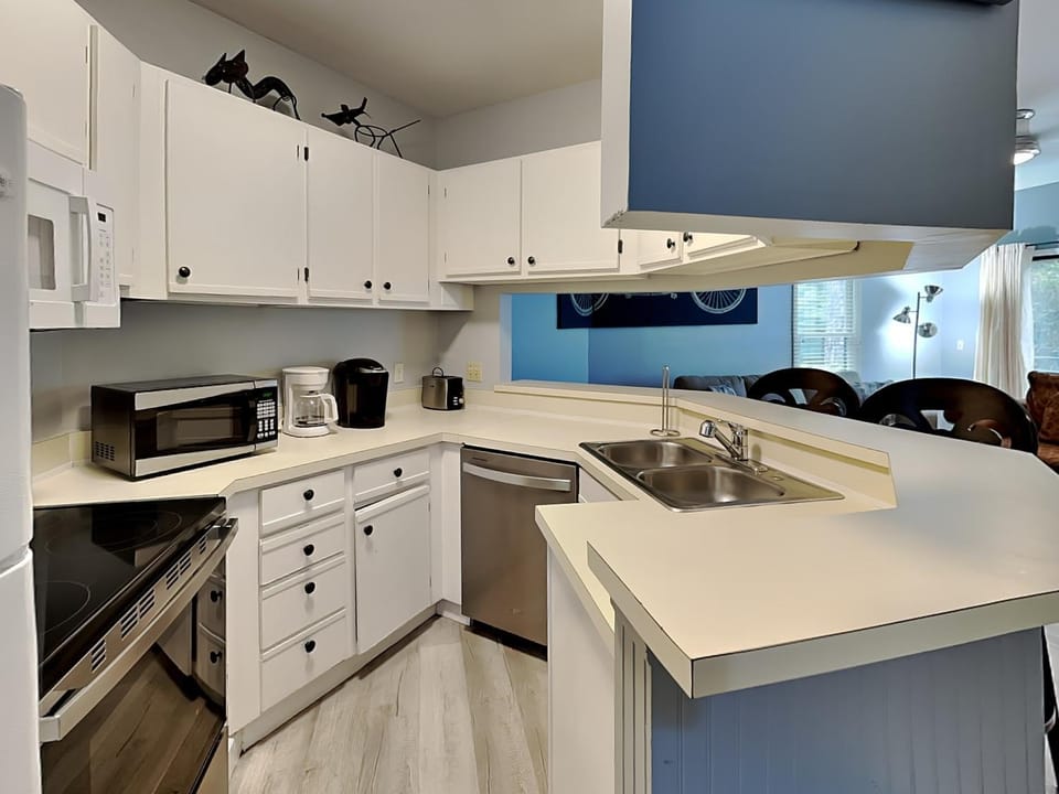 Kitchen or kitchenette, dishwasher, microwave, oven, stove, kitchen